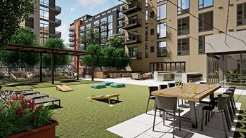 A modern outdoor seating area with a table and chairs.